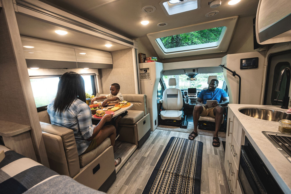 2022 Thor Gemini AWD Class B+ RV Lifestyle Maine Corporate Photo Shoot family sitting in living area