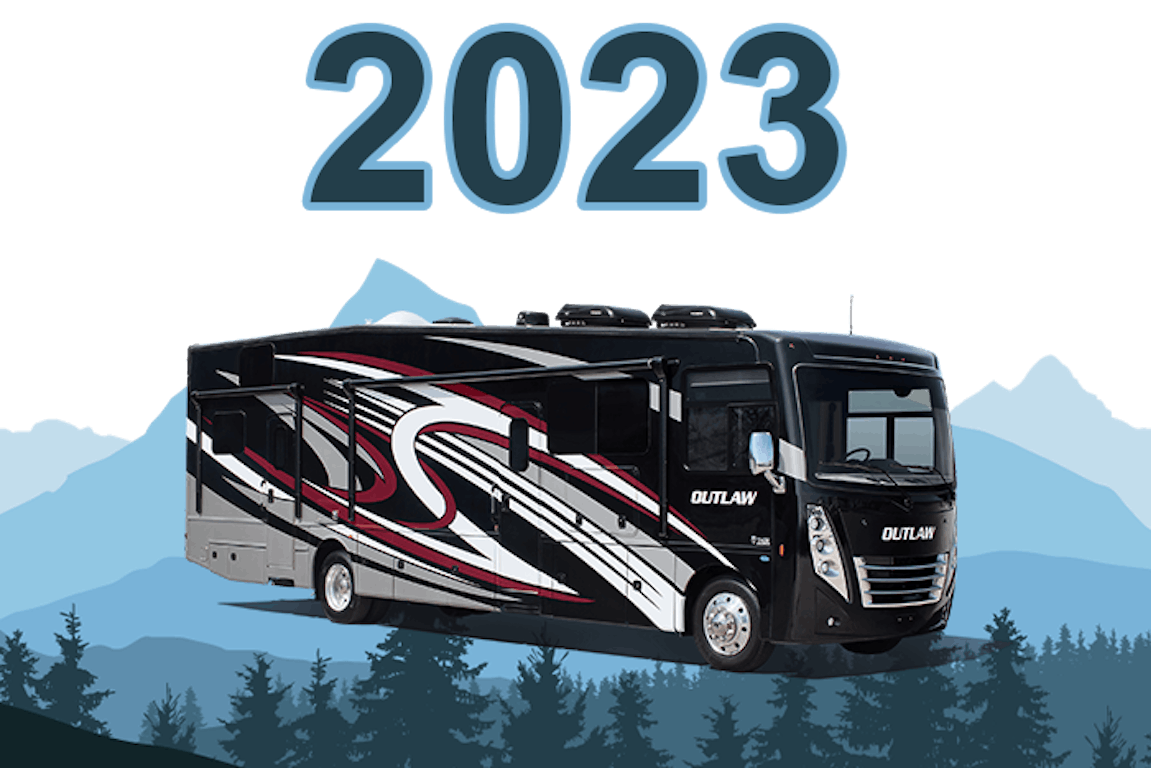 outlaw class a 2023 exterior with trees and mountains all around