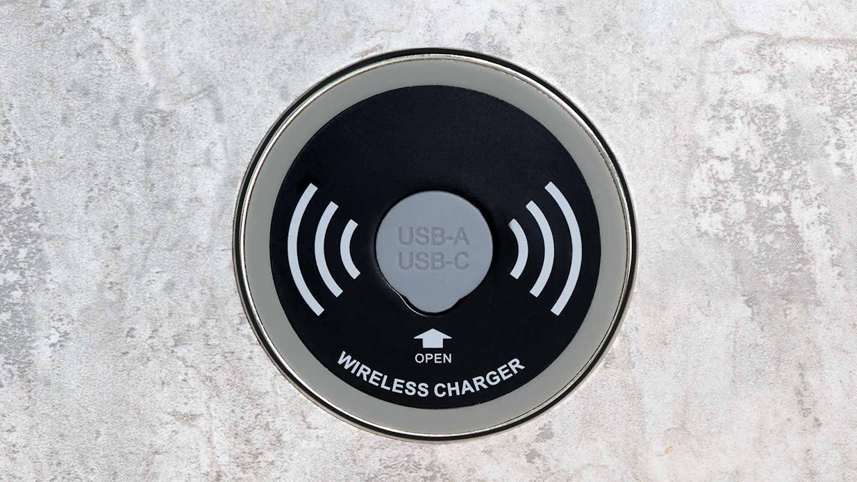 Wireless phone charger with USB plug on dinette