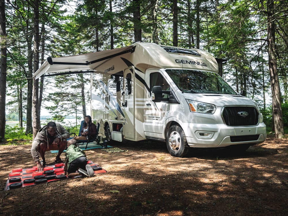 2022 Thor Gemini AWD Class B+ RV Lifestyle Maine Corporate Photo Shoot playing chess with family