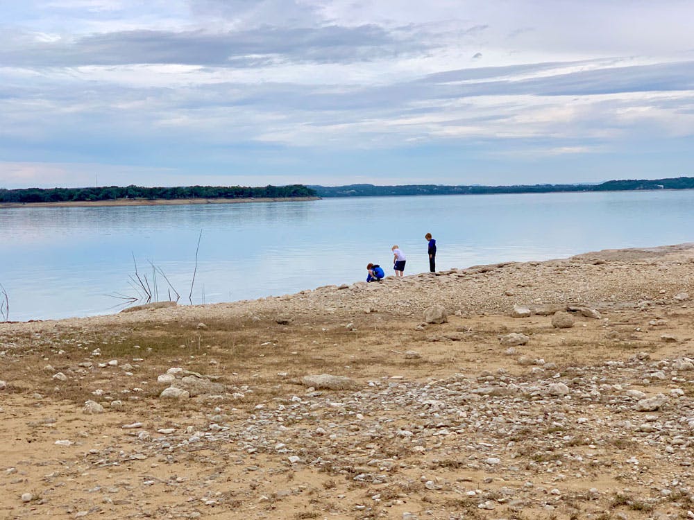 Blog Photo 7 Lessons Kids Learn Through RVing - friends by the lake