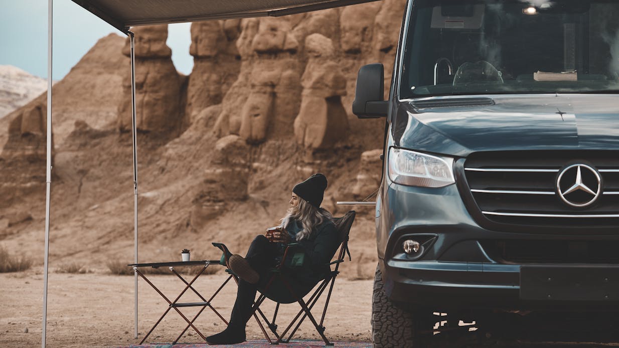 2022 Sanctuary Class B RV Sprinter Van - Key Feature Lifestyle sitting under the awning utah Kalen thorien shoot