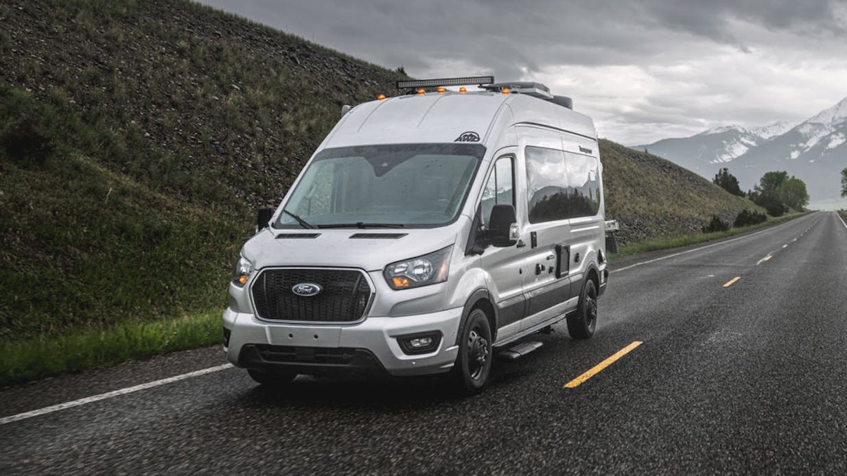 Tranquility Transit Van driving in montana
