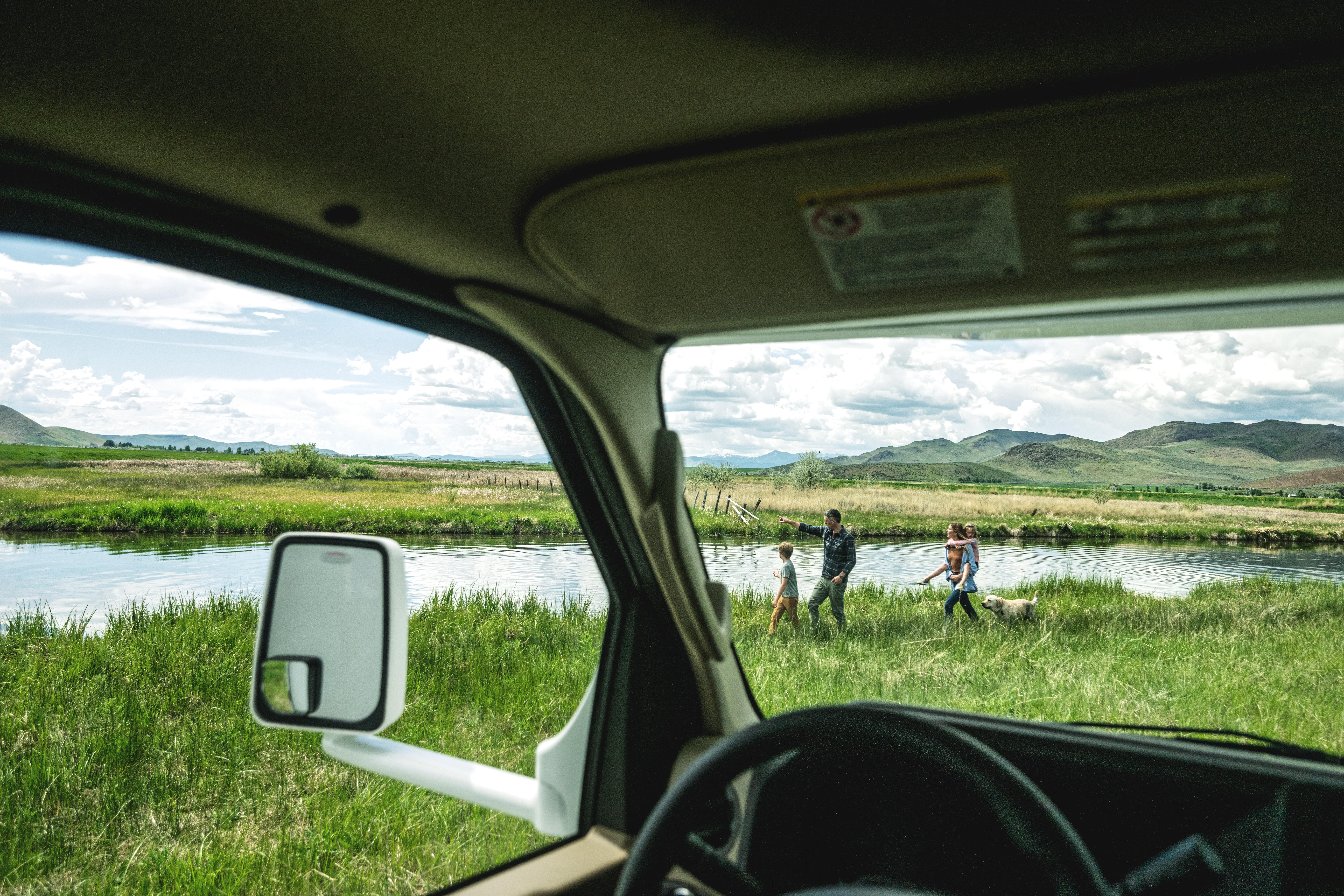 Family walking outside of Class C motorhome