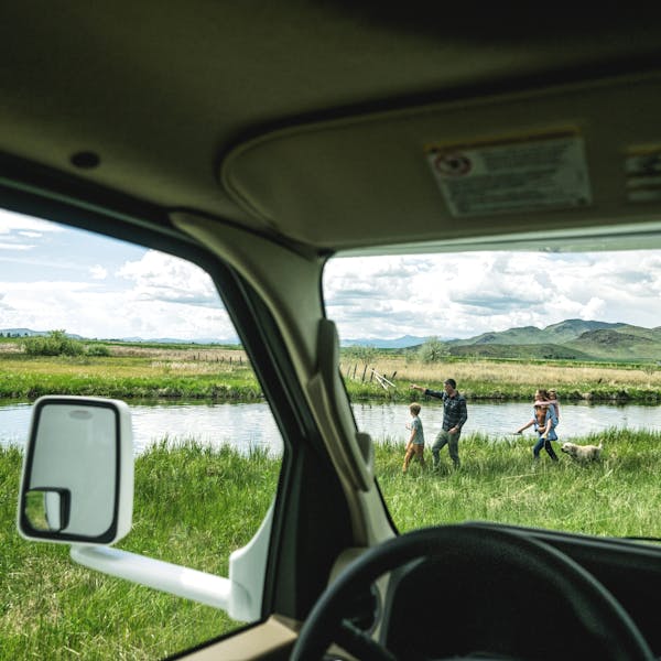 Family walking outside of Class C motorhome