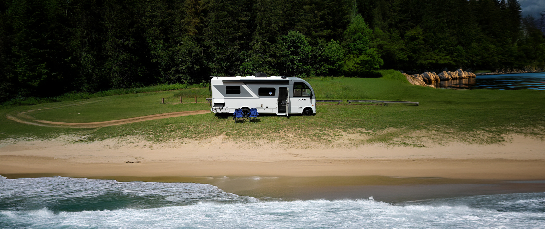 Axis 26.1 parked beside the coast with a pond behind