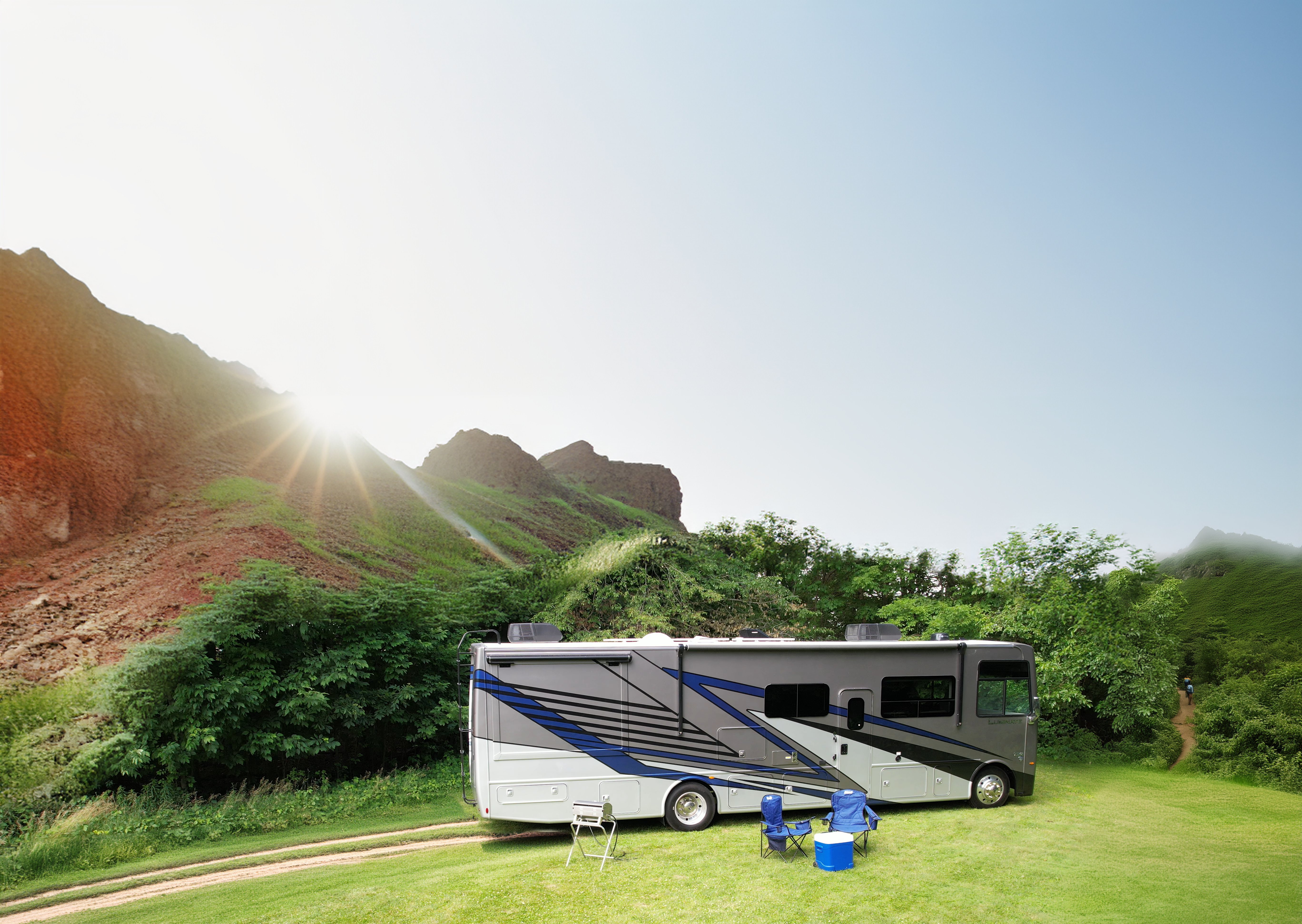 Luminate Class A Gas with sun and mountains