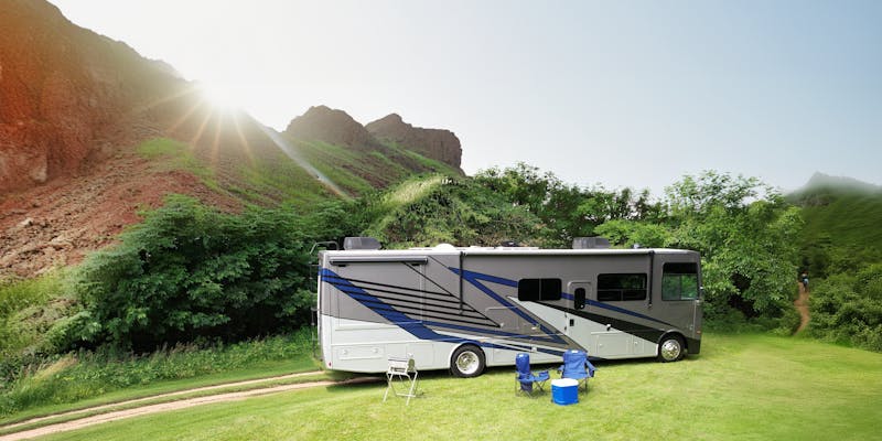 Luminate Class A Gas with sun and mountains