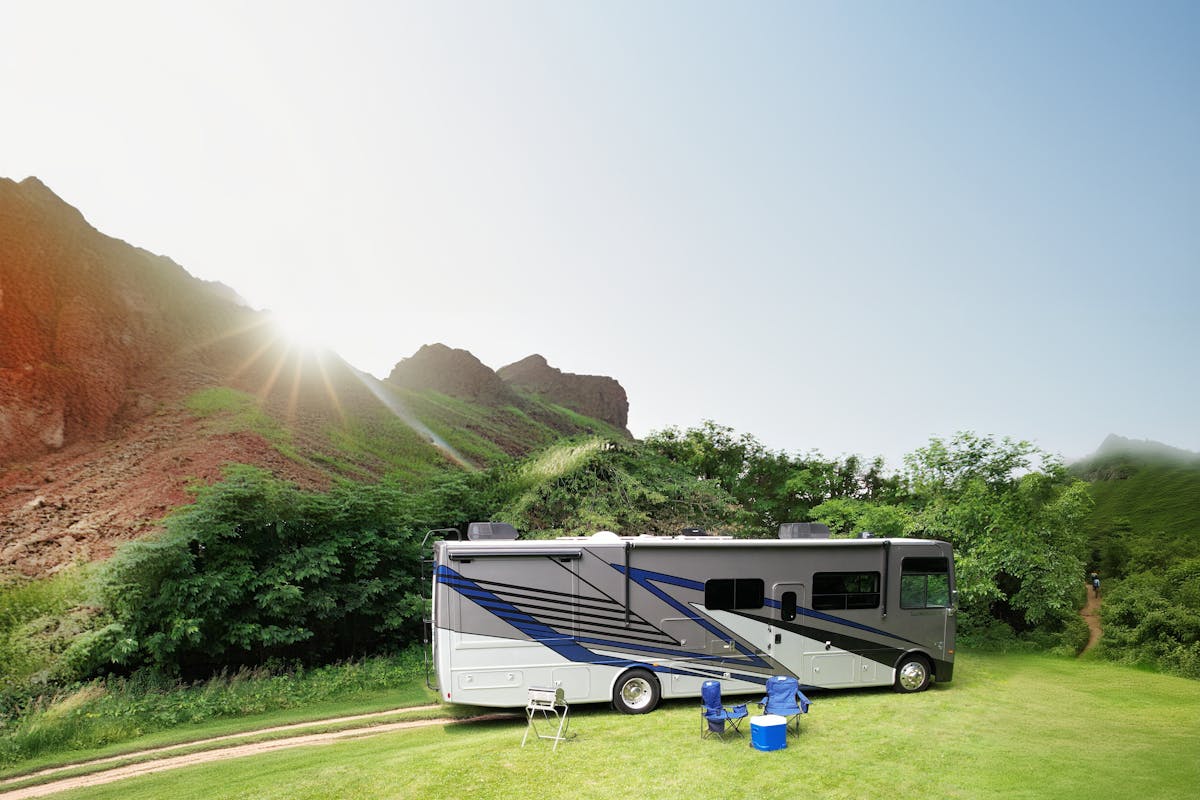 Luminate Class A Gas with sun and mountains