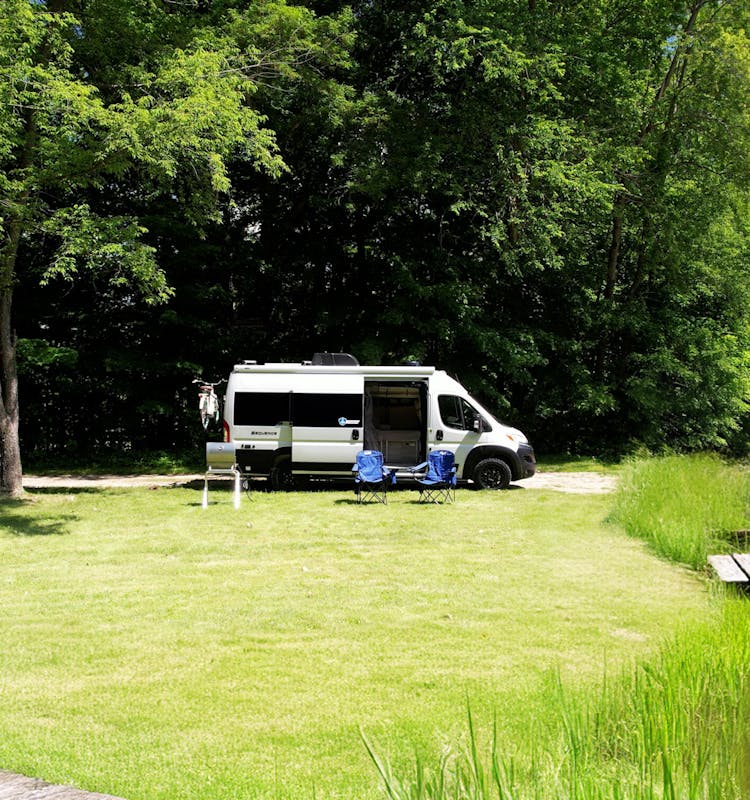 Sequence parked by lake class b van