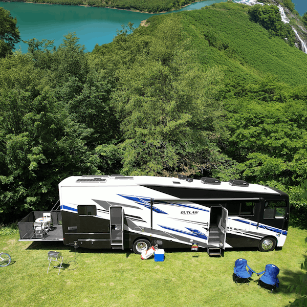 2025 Outlaw Wild West with lake and trees in background