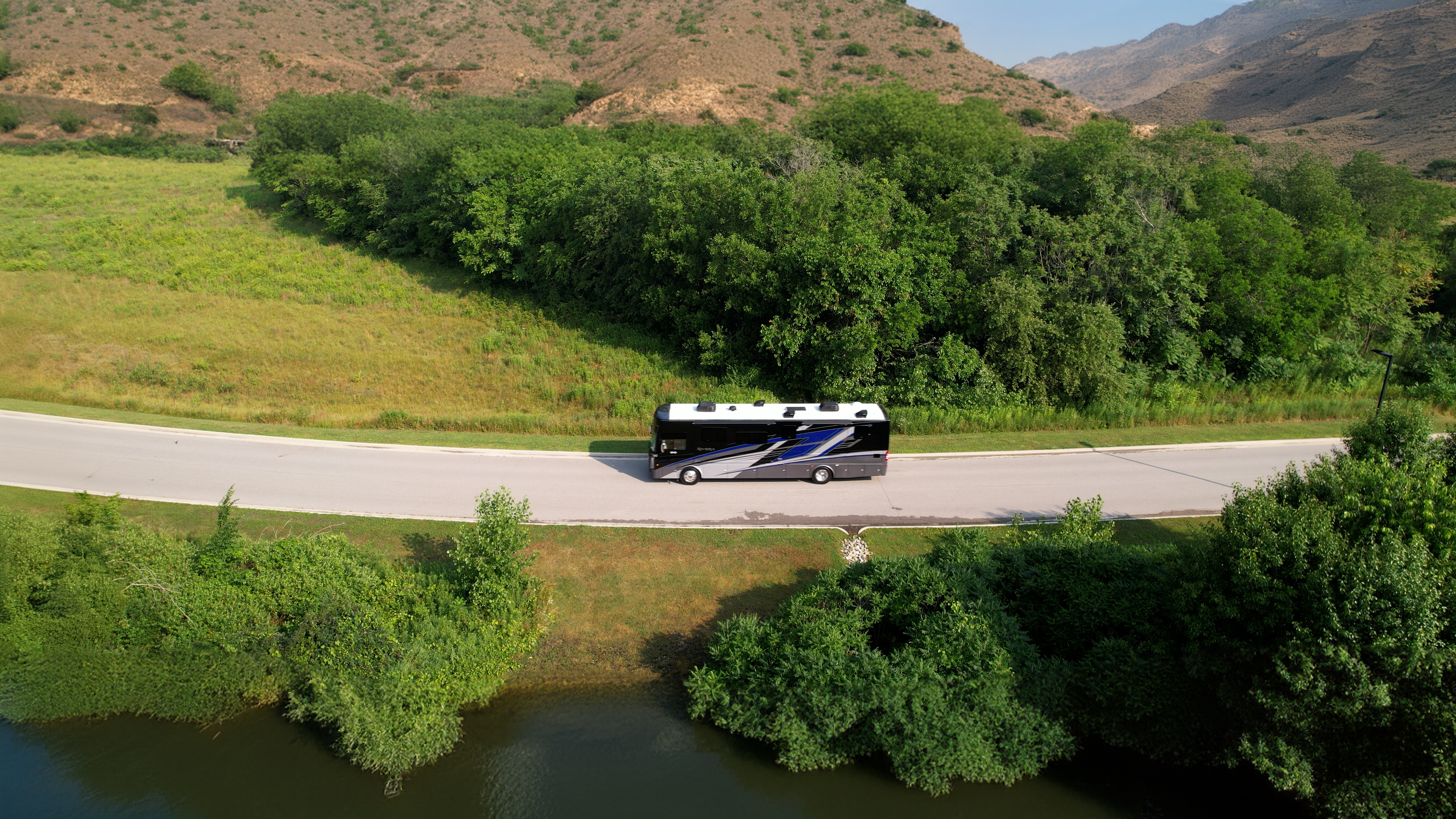 2025 Riviera Class A Diesel RV driving on scenic road