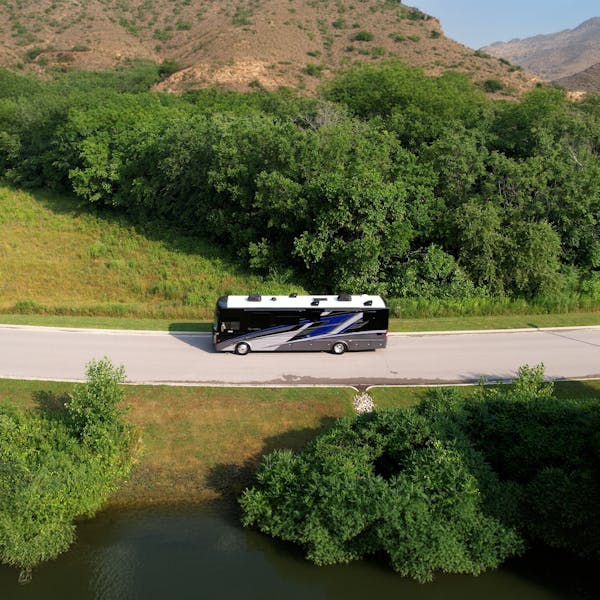 2025 Riviera Class A Diesel RV driving on scenic road