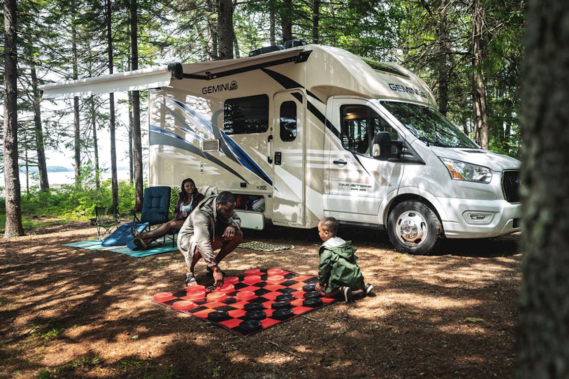 2022 Thor Gemini AWD Class B+ RV Lifestyle Maine Corporate Photo Shoot playing chess with family