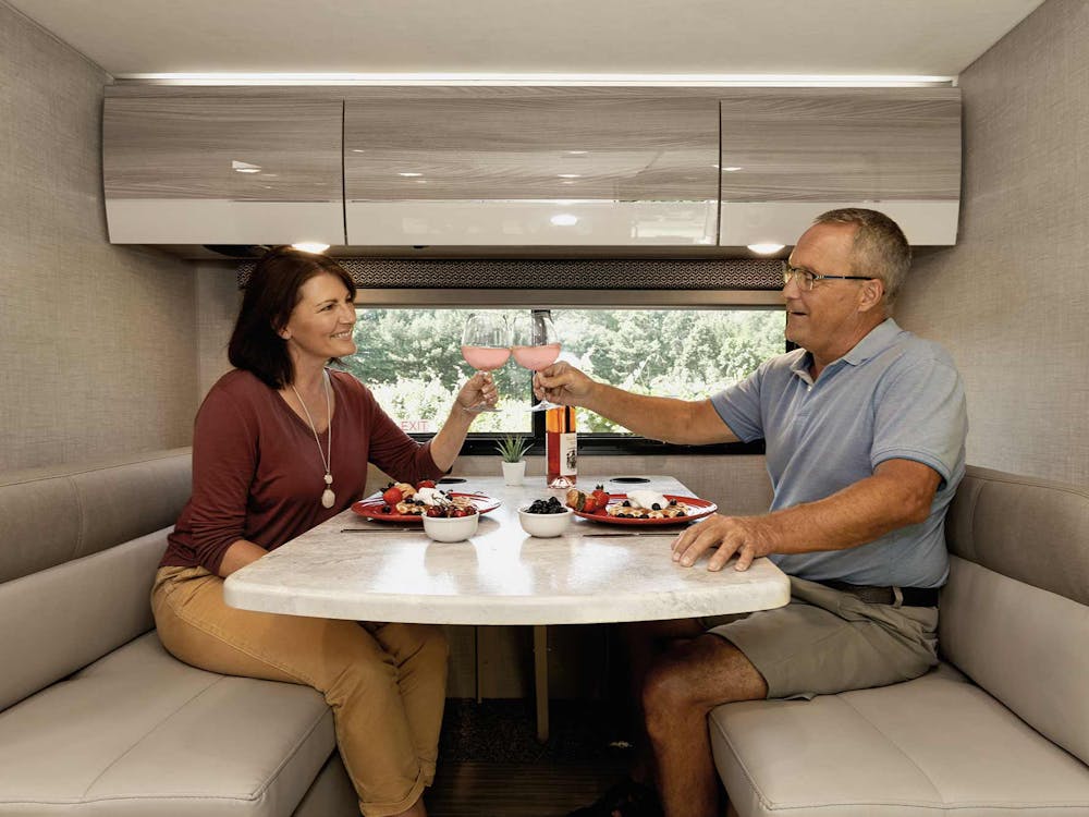 2020 Thor Delano Mercedes Sprinter RV Lifestyle winery photo shoot dinette photo with couple
