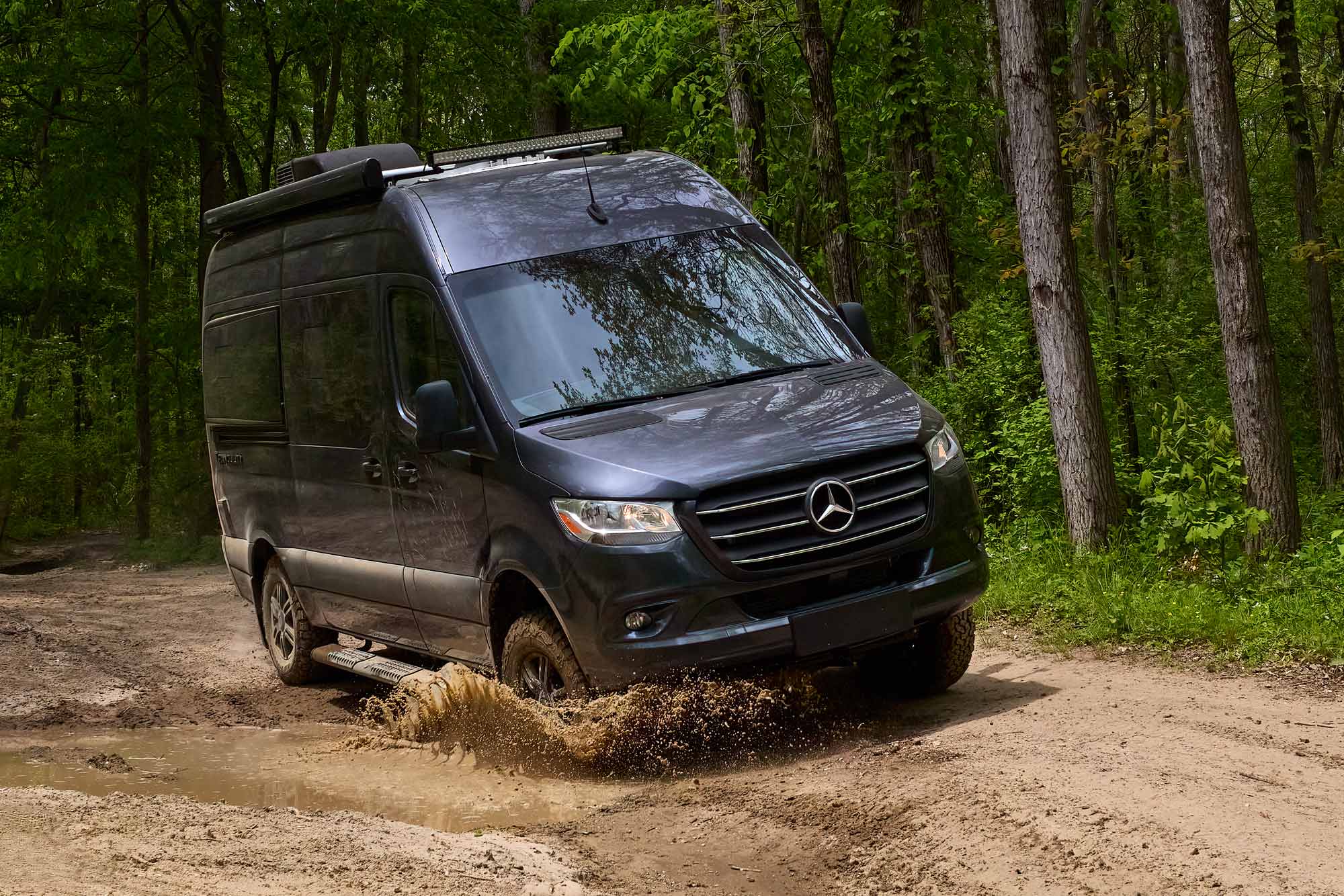 2022 Thor Tranquility Class B RV Sprinter Van Tenorite Grey Full Body Paint Exterior Lifestyle in the mud