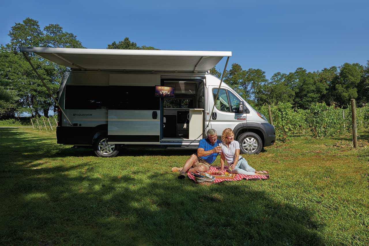 2020 Thor Sequence Class B Camper Van RV lifestyle winery photo shoot couple sitting on picnic blanket at winery