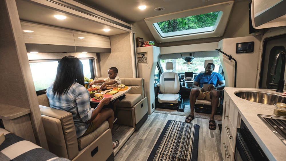2022 Thor Gemini AWD Class B+ RV Lifestyle Maine Corporate Photo Shoot family sitting in living area
