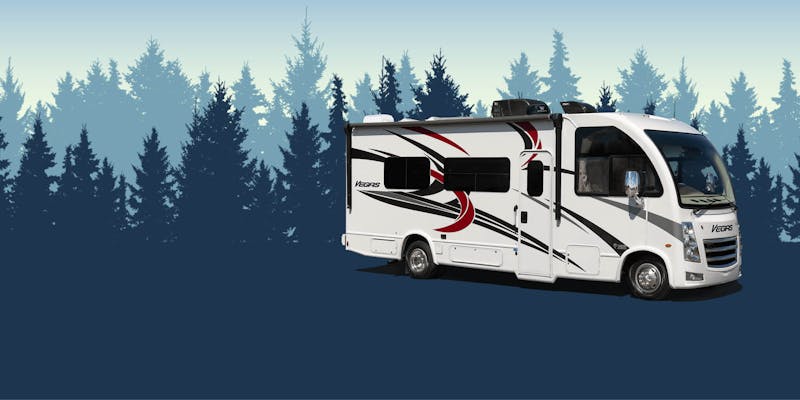 Vegas class a motorhome with blue trees
