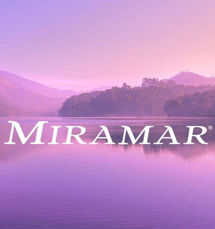 Miramar logo with purple hue over beautiful lake and mountains