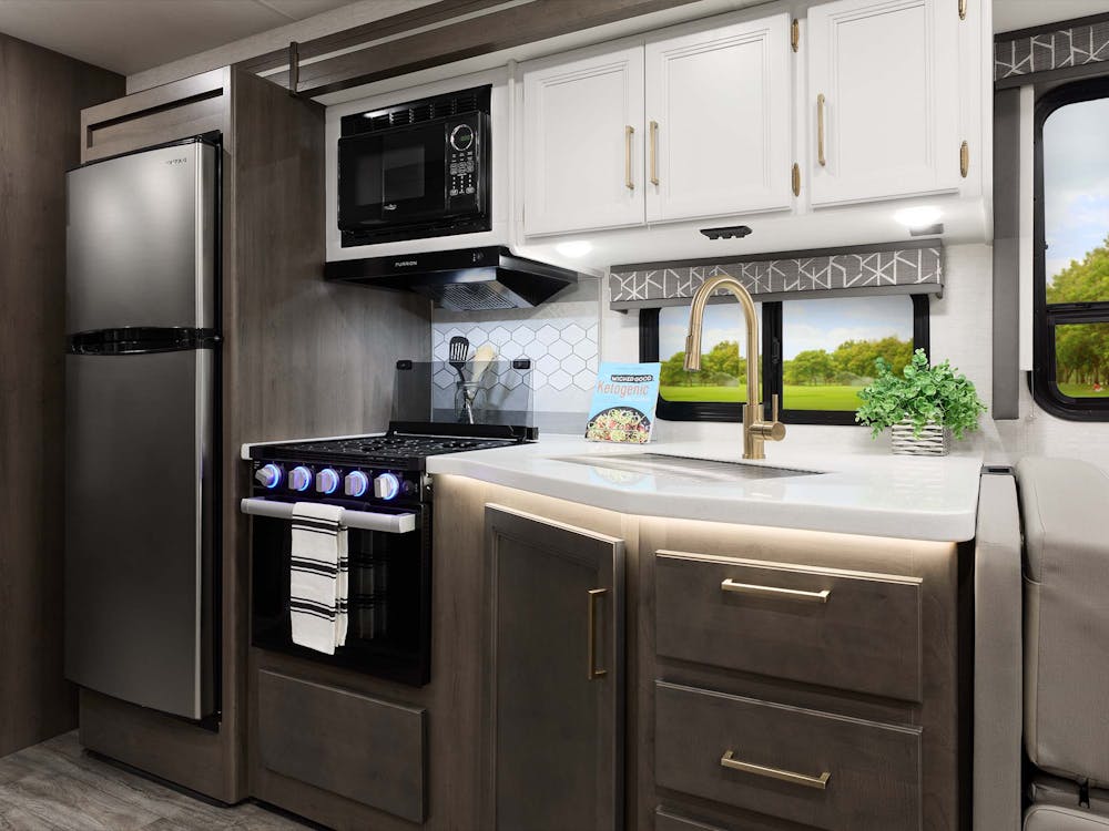 Resonate class a gas motorhome kitchen with malibu collection cabinetry