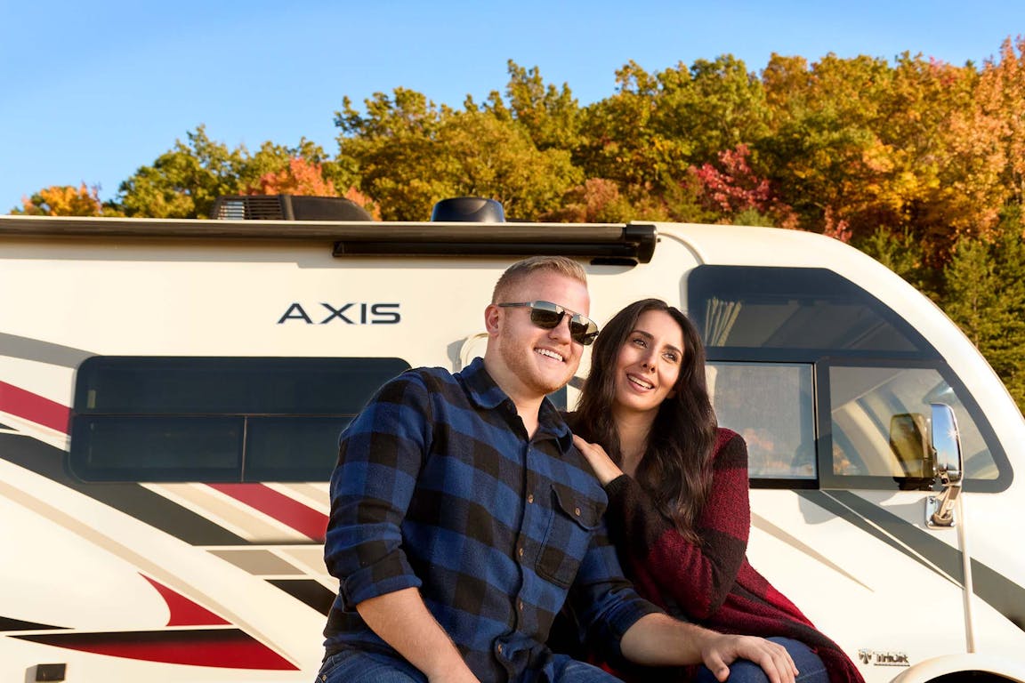 2022 Thor Axis Class A RV lifestyle Tennessee shoot couple with sunglasses smiling