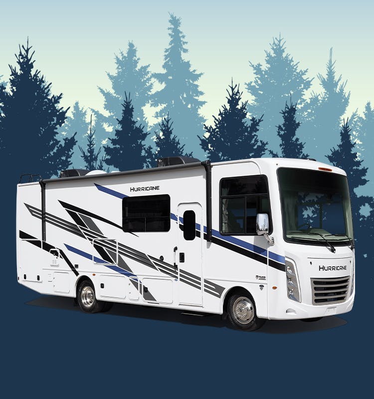 Hurricane class a gas motorhome in front of blue trees