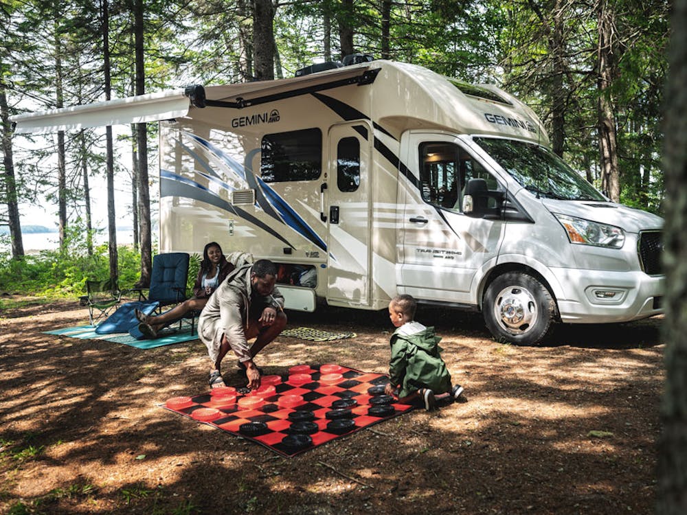 2022 Thor Gemini AWD Class B+ RV Lifestyle Maine Corporate Photo Shoot playing chess with family